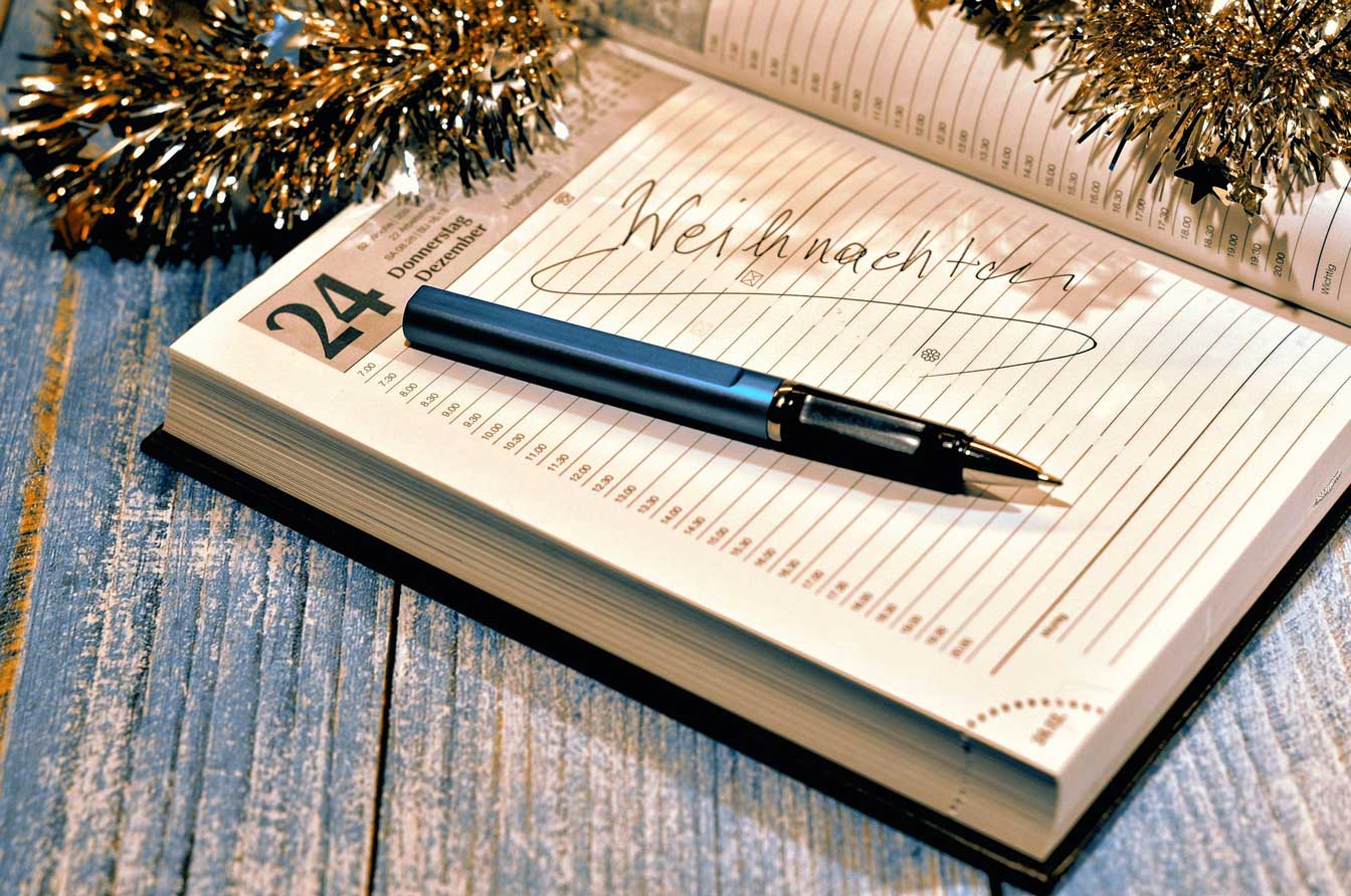 A photo of a diary showing a page for 24th December. It has a pen on top of it.